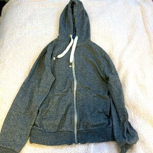grey zip up.